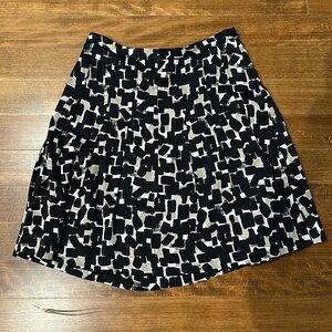 White House Black Market black, tan and white skirt sz 4 with high soft pleats.